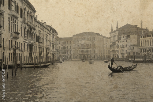 Vintage view of Venice with gondola. Effect with grunge background