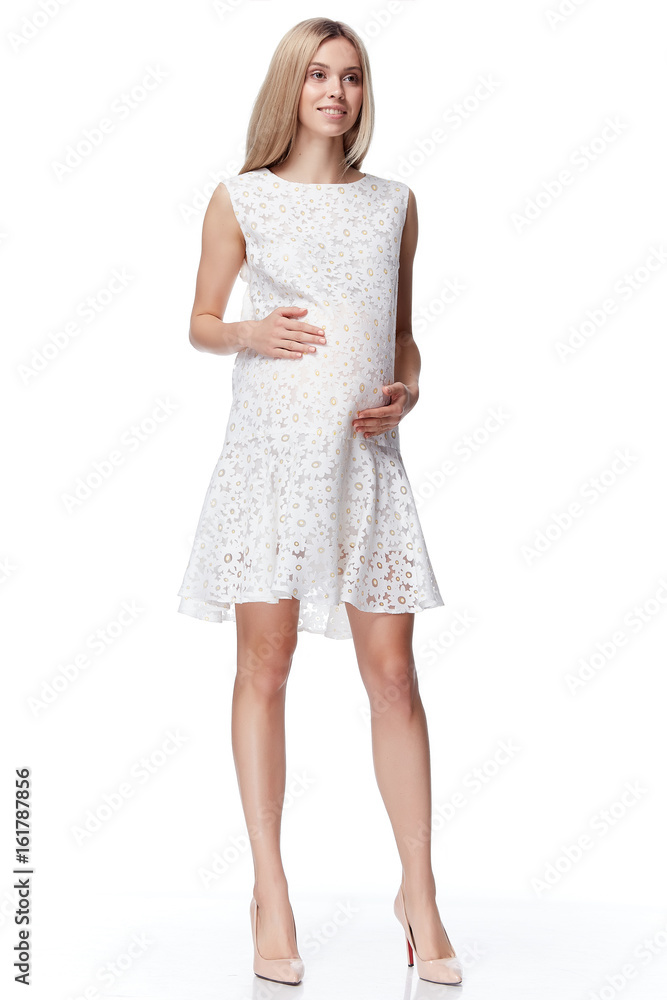 Beautiful elegant pregnant woman blond hair wear style fashion dress for mother hold in hand tummy wait for baby child new born pretty lady clothes for pregnancy white background collection heath. Beautiful elegant pregnant woman blond hair wear style fashion dress for mother hold in hand tummy wait for baby child new born pretty lady clothes for pregnancy white background collection heath.