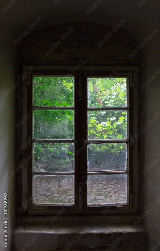 The window of an old farmhouse inside The window of an old farmhouse inside