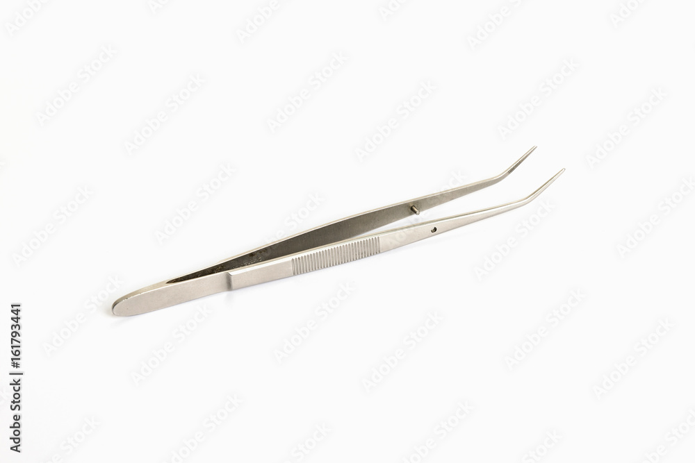 Tweezers tool isolated on white background. Closeup shot. top view Tweezers tool isolated on white background. Closeup shot. top view