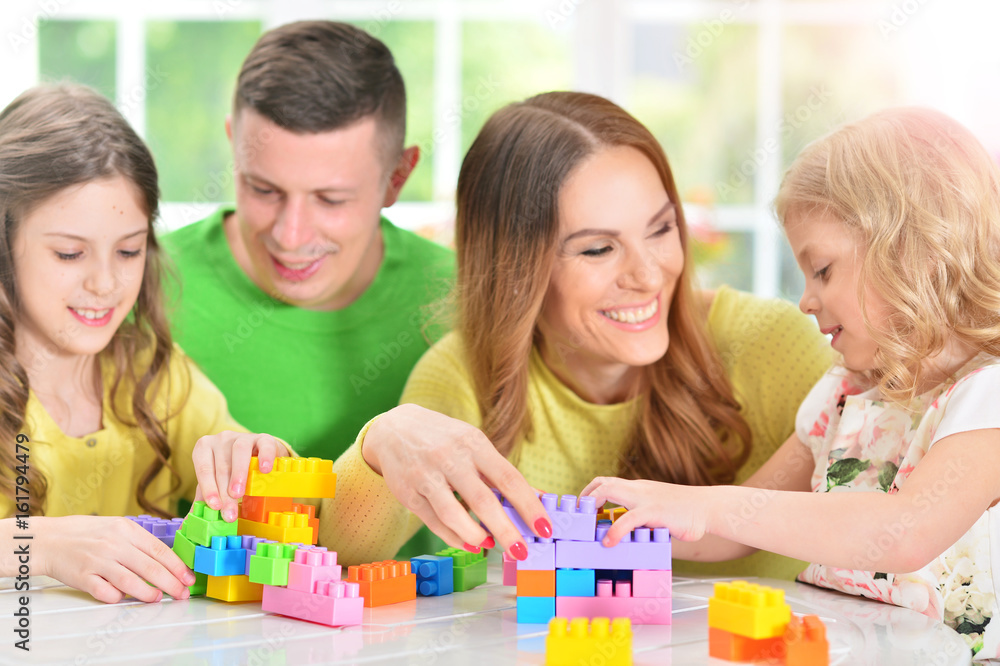 Family collecting blocks together Family collecting blocks together