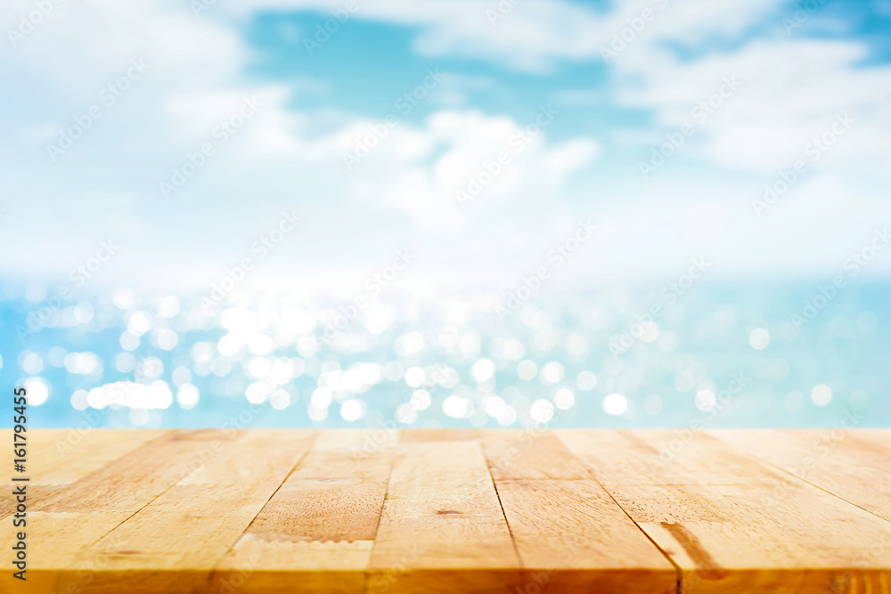 Wood table top on blur sparkling sea water and summer sky background - obrazy, fototapety, plakaty 