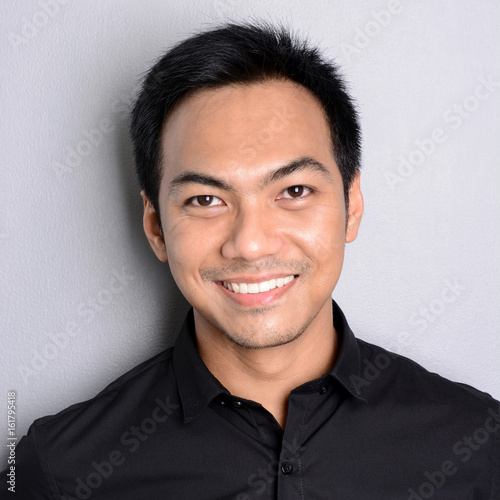 Attractive smiling Asian man