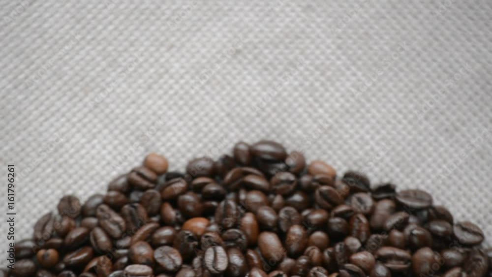 The coffee beans rotates on the turntable. The coffee beans rotates on the turntable.