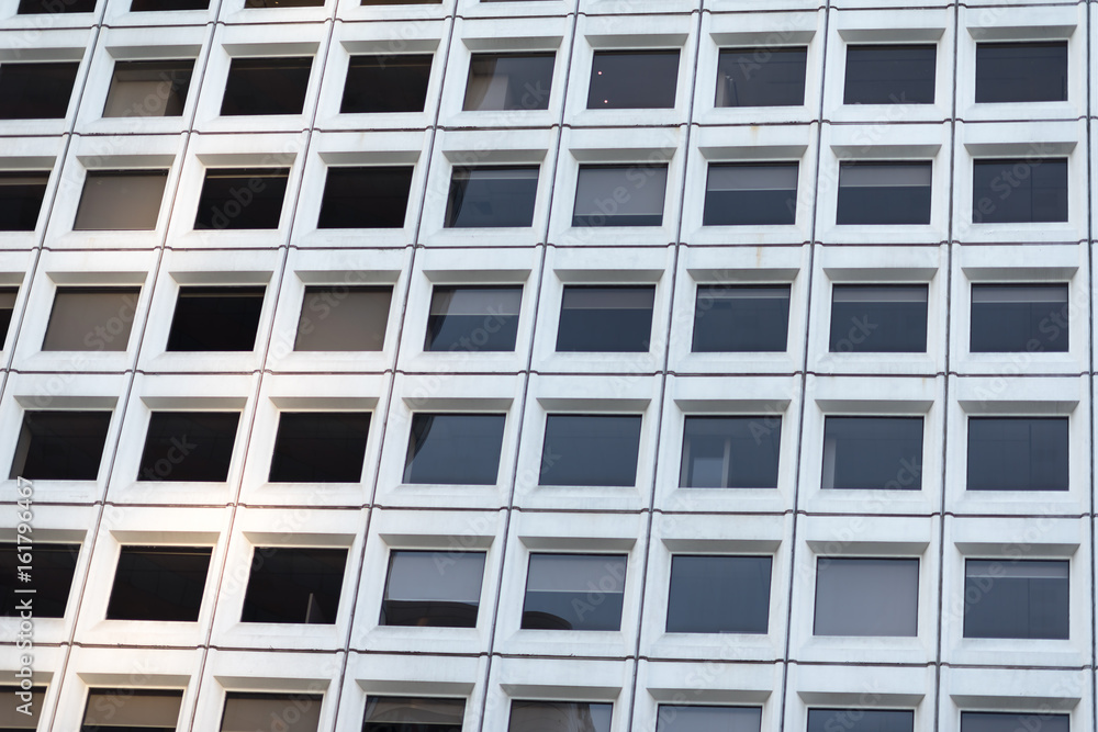 Office building windows in a downtown district Office building windows in a downtown district