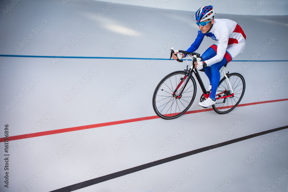 Fototapeta premium Racing cyclist on velodrome outdoor.
