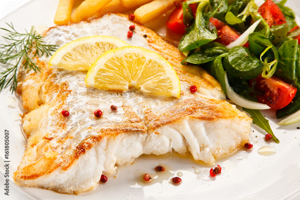Fish dish - fried fish fillet and vegetables Fish dish - fried fish fillet and vegetables