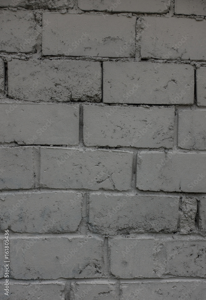 Fototapeta premium The old brick and stone wall with plaster