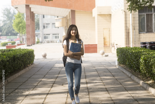 Female college students walking in the campus