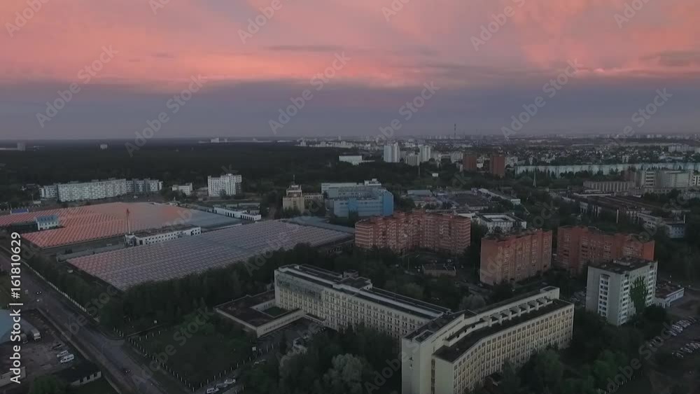 Aerial view, evening view of the city at sunset. 50 fps. View from a height.
Aerial view, evening view of the city at sunset. 50 fps. View from a height.