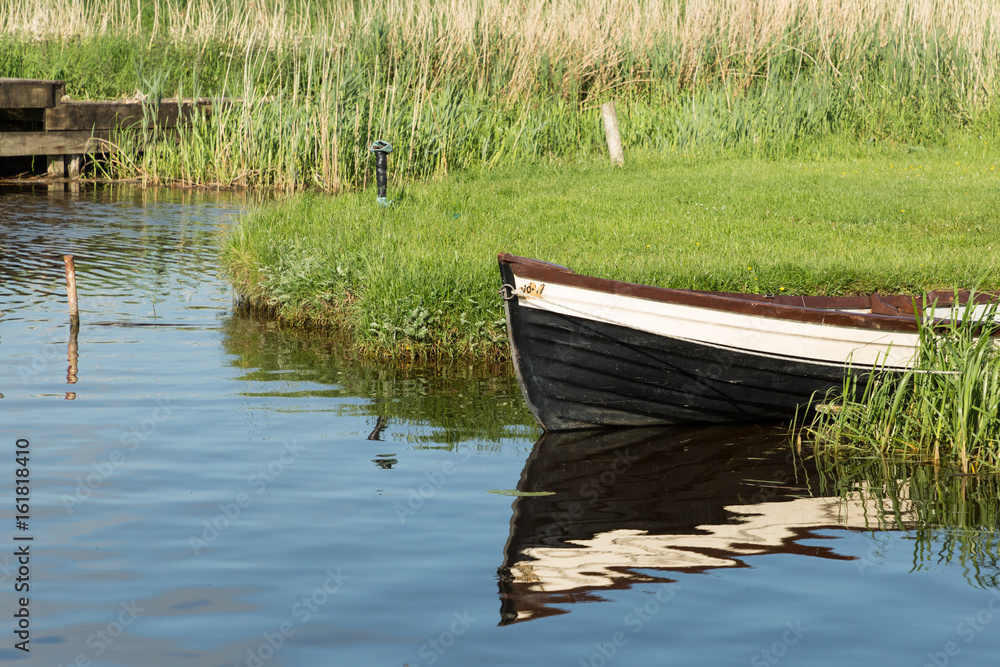 boat moored on the banks of the River Shannon boat moored on the banks of the River Shannon