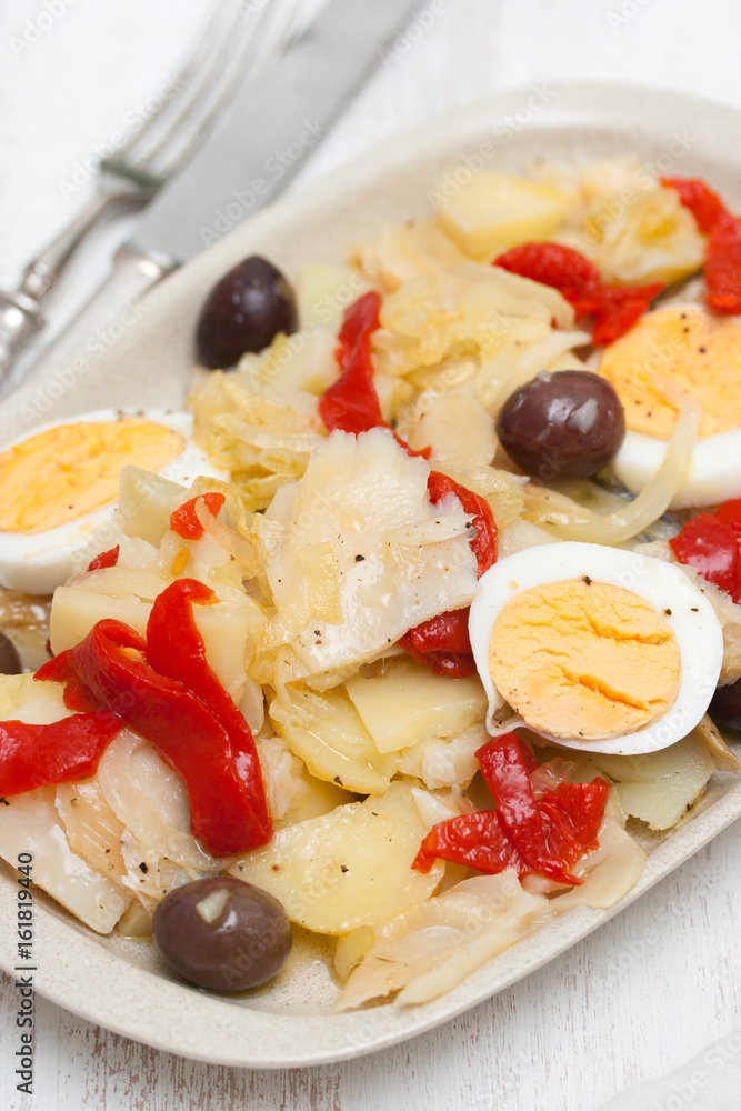 cod fish with boiled vegetables and egg on the dish cod fish with boiled vegetables and egg on the dish