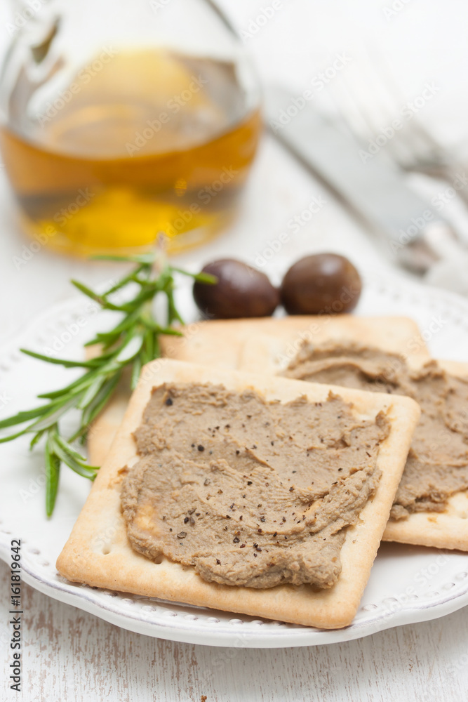 pate with toasts on white plate pate with toasts on white plate