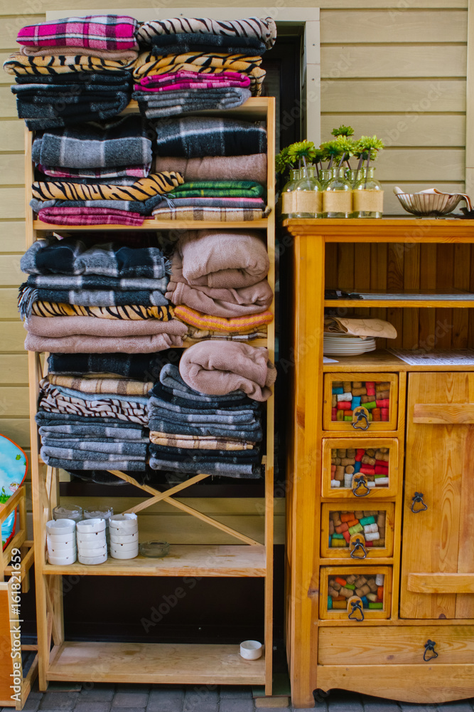 Stacked blankets in a retro cabinet Stacked blankets in a retro cabinet