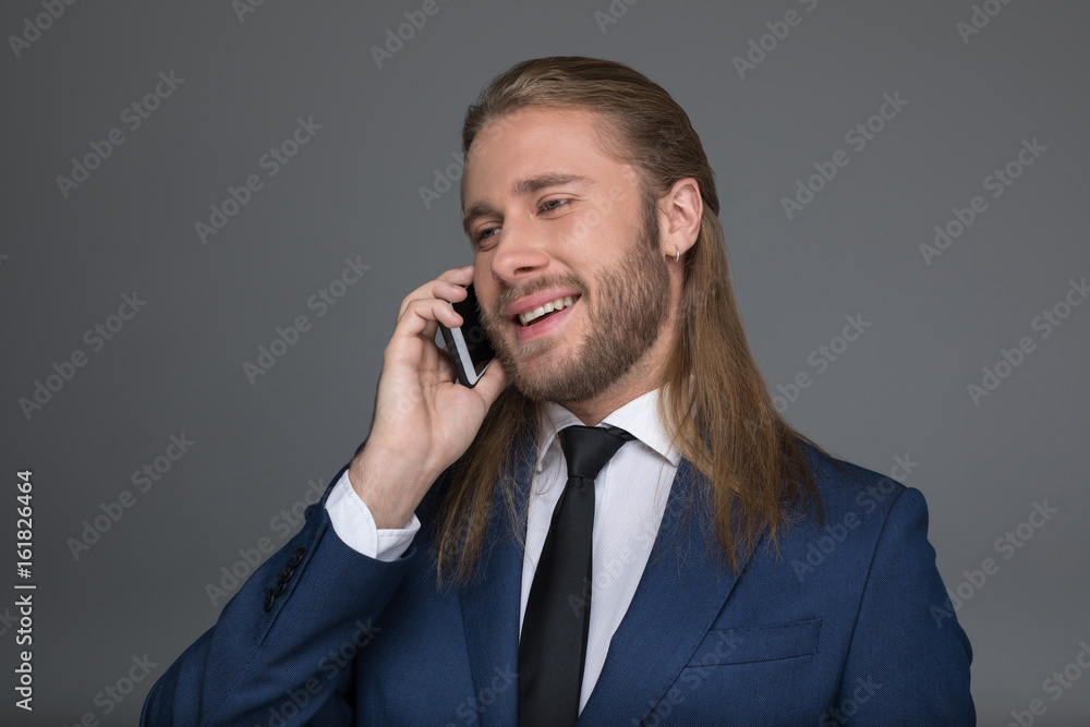 young man in tuxedo making marriage proposal to his girlfriend