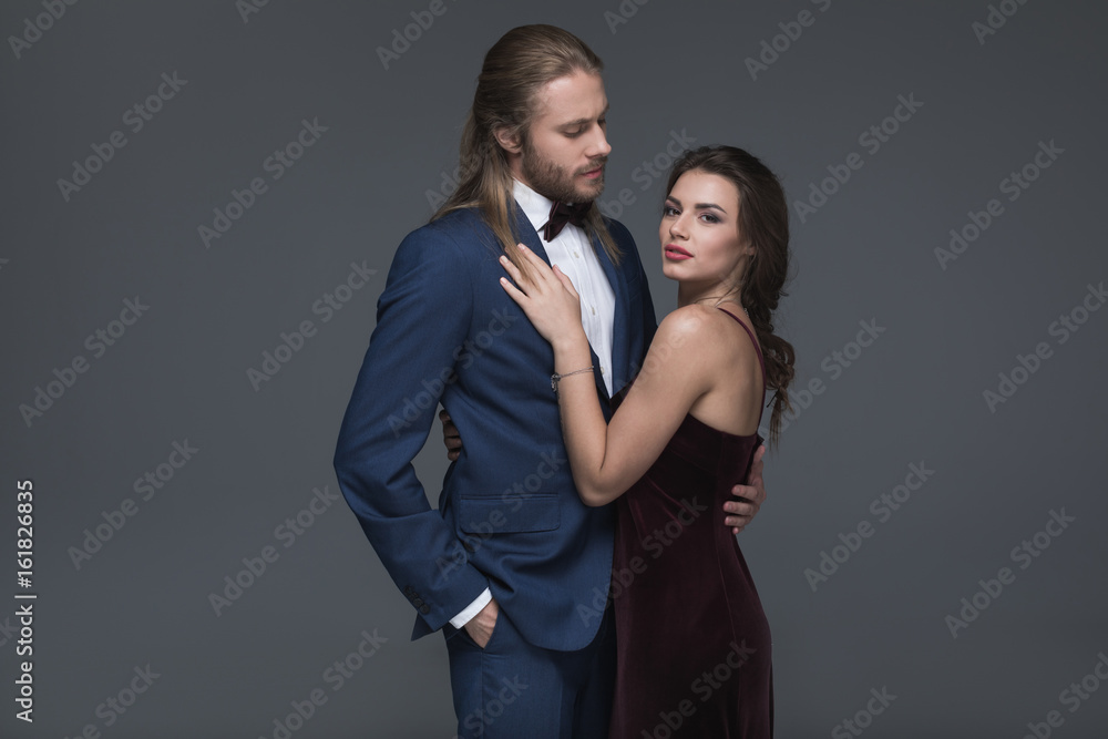 young man in tuxedo making marriage proposal to his girlfriend young man in tuxedo making marriage proposal to his girlfriend