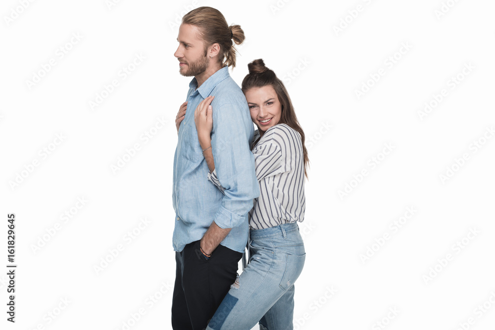 Happy young woman hugging handsome man standing isolated on white Happy young woman hugging handsome man standing isolated on white