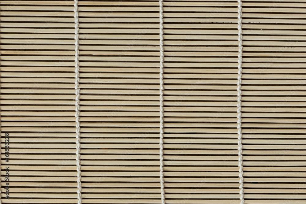 Japanese bamboo mat for rolled sushi. Close up bamboo sushi mat texture for background or wallpaper for your design. Bamboo sushi mat in macro concept for background. Japanese bamboo mat for rolled sushi. Close up bamboo sushi mat texture for background or wallpaper for your design. Bamboo sushi mat in macro concept for background.