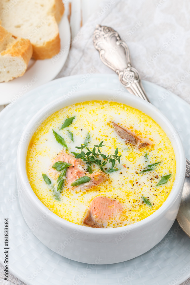 Creamy fish soup with salmon, potatoes, onions and carrots. Kalakeitto. Traditional dish of the Finnish cuisine