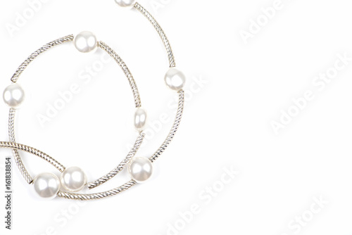 Pendant with pearls on a white background.