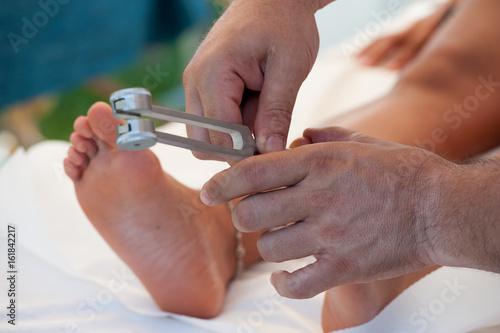 Fotografi A plantar reflexology session with the tuning fork