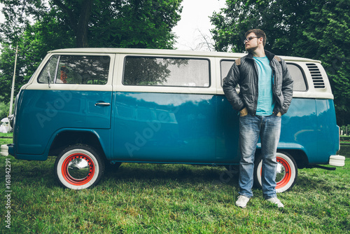 man stop to rest in the park on his van photo