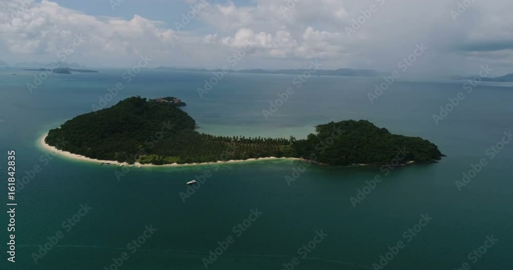 Aerial view of tropical island Koh Rang Yai and sea with moored yachts Aerial view of tropical island Koh Rang Yai and sea with moored yachts