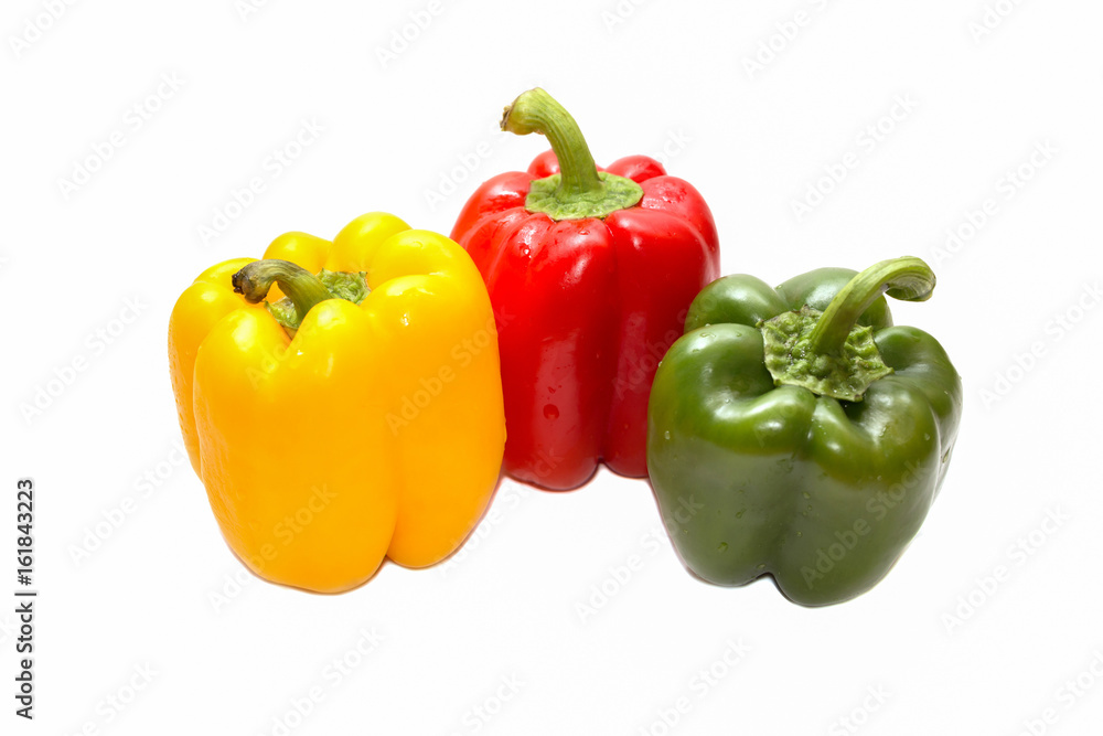 Colored bell peppers on white background Colored bell peppers on white background