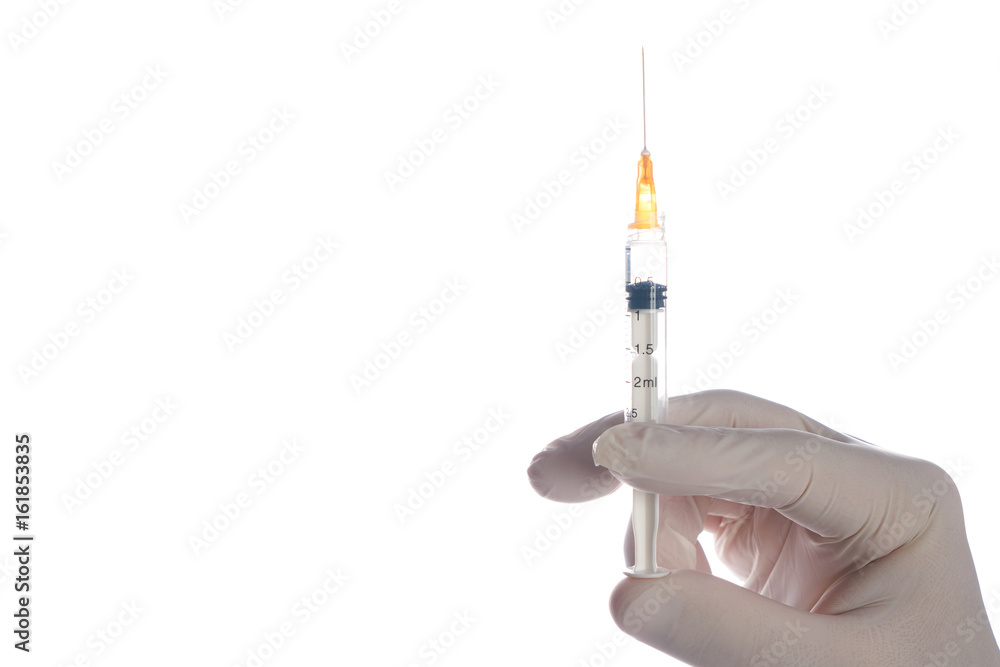 The doctor's hand held syringe with preparation jet from the needle. Medical man holding injector with drugs in arm isolated on white background with copy space. Botox injection syringe therapy. The doctor's hand held syringe with preparation jet from the needle. Medical man holding injector with drugs in arm isolated on white background with copy space. Botox injection syringe therapy.