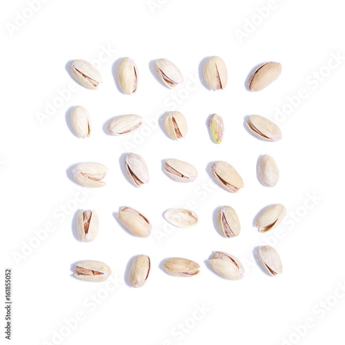 Salty pistachios on white background set