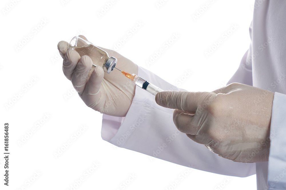 Syringe, medical injection in doctor's hand. Medicine vaccination equipment with needle. Doctor in a white surgical gown isolated on white background. Liquid drug or narcotic. Health care in hospital. Syringe, medical injection in doctor's hand. Medicine vaccination equipment with needle. Doctor in a white surgical gown isolated on white background. Liquid drug or narcotic. Health care in hospital.