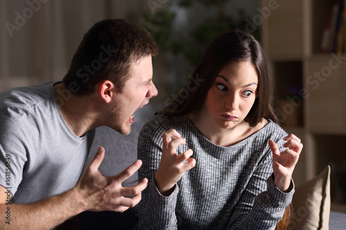 Couple arguing and shouting at home photo