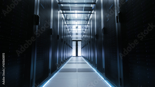 Fototapeta Naklejka Na Ścianę i Meble -  View Through Big Working Data Center with Server Racks.