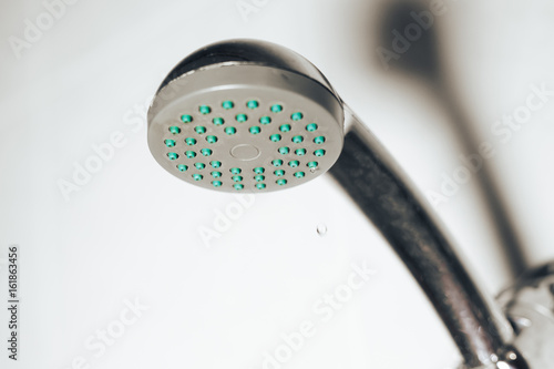 Showerhead in a bathroom . shower leaking in the bathroom