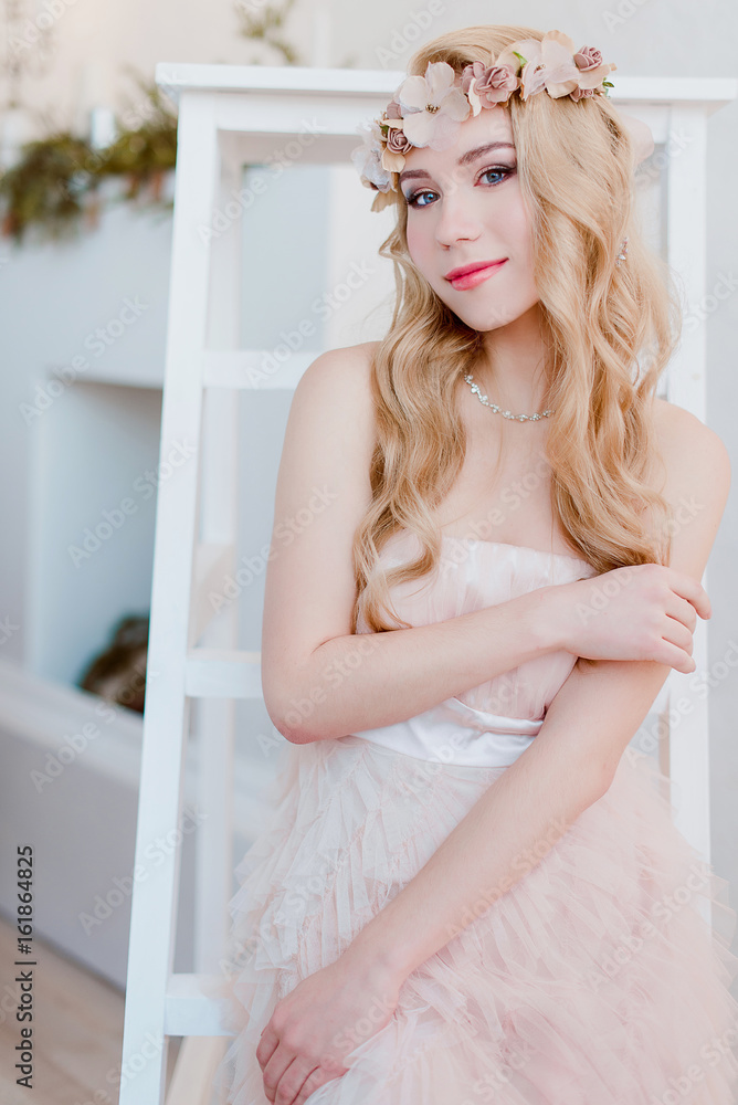picture of young blonde woman wearing wreath of flowers, spring tender and romantic portrait, fashion retouched shot picture of young blonde woman wearing wreath of flowers, spring tender and romantic portrait, fashion retouched shot