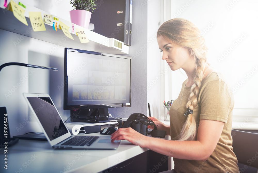 Woman working on computer at home office Woman working on computer at home office