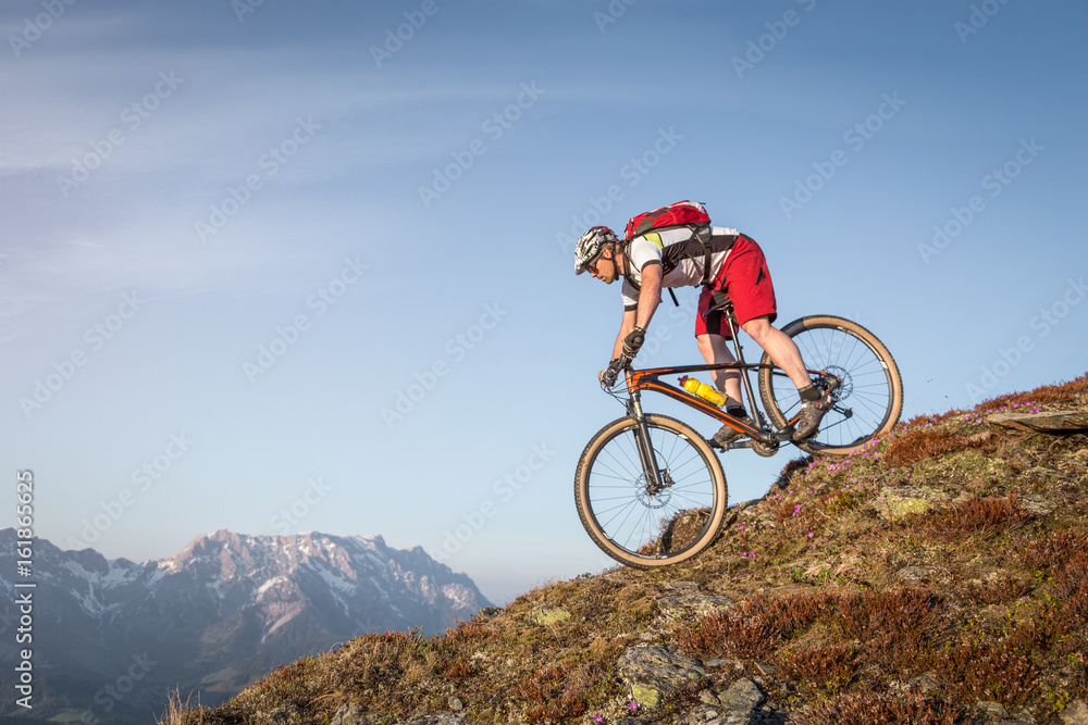 Male mountainbiker on a trail in the mountains