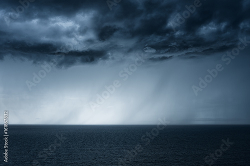 rain on the sea with stormy clouds