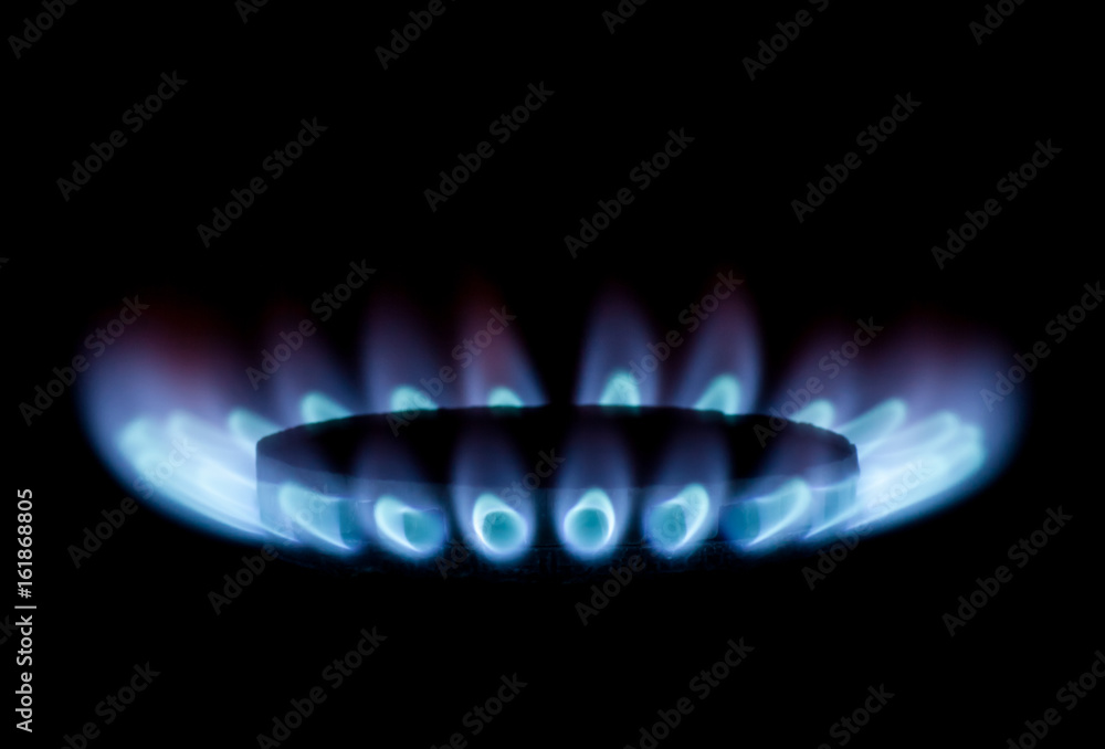 Blue gas flame on a black background Blue gas flame on a black background
