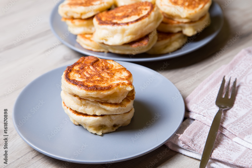 Fritters on kefir, yeast dough. Traditional Russian dish Fritters on kefir, yeast dough. Traditional Russian dish