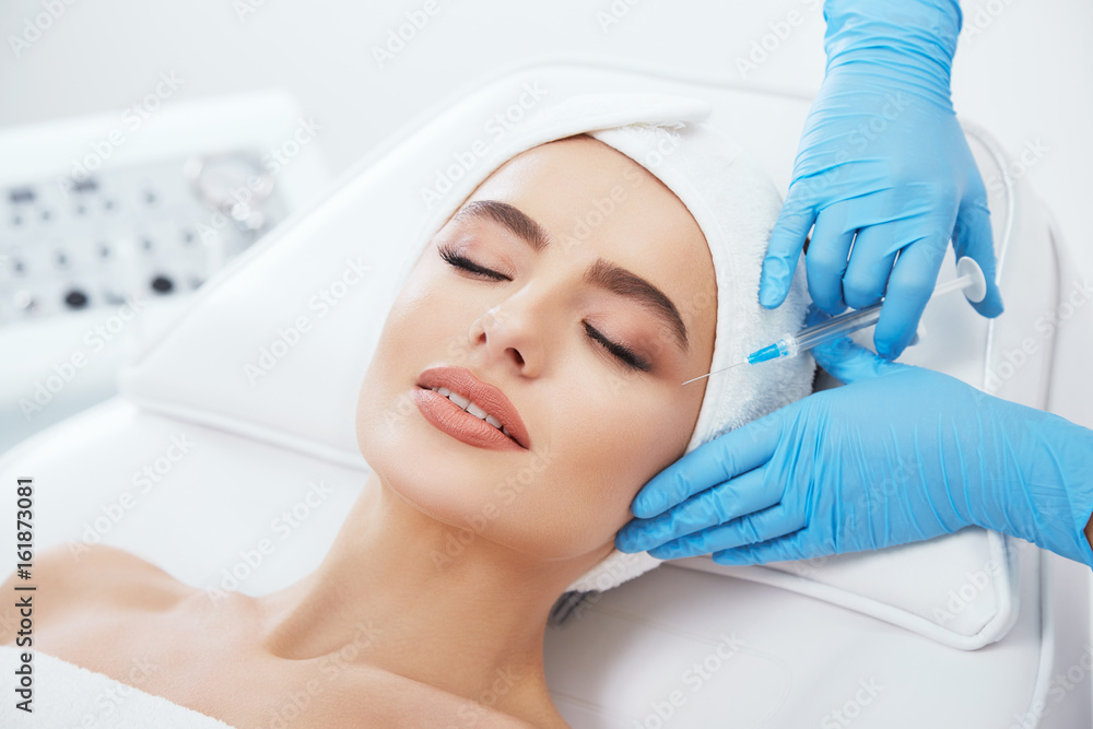Gorgeous girl doing cosmetic procedure