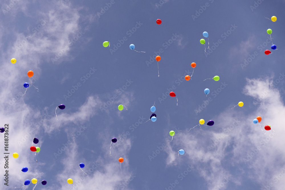 Colored flying balloons in the blue sky Colored flying balloons in the blue sky