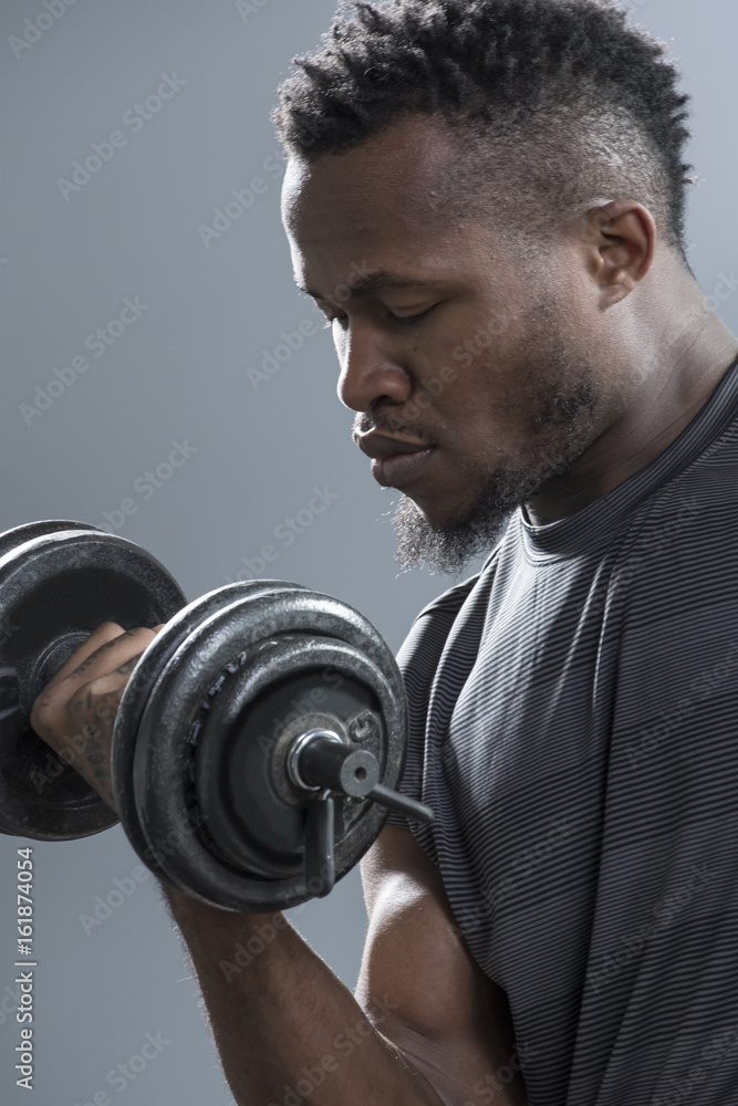 Close up of man's biceps during doing curling exercise Close up of man's biceps during doing curling exercise