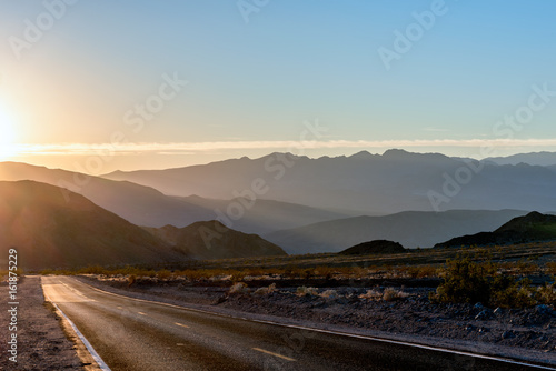 Desert Highway heading to sunset photo