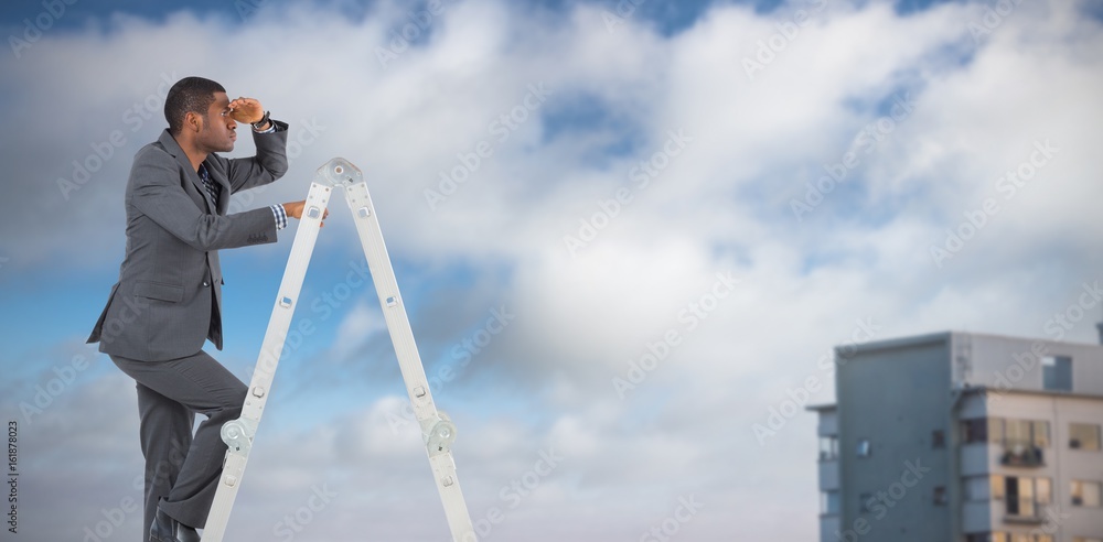 Composite image of businessman standing on ladder looking