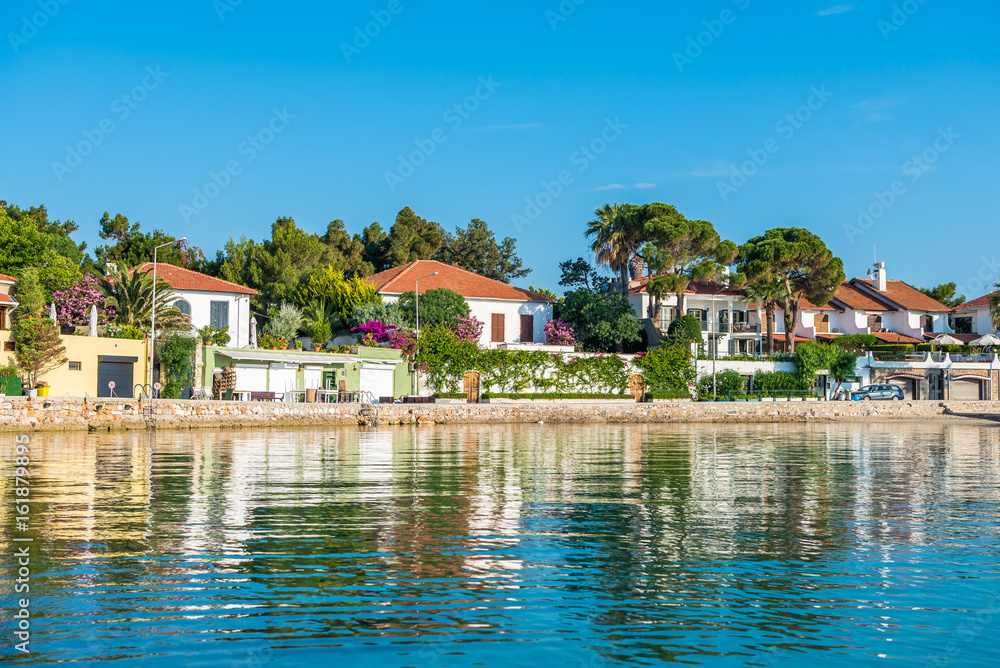 Cesme, Turkey - Ilica Beach view in June. Ilica Beach is popular tourist destination in Turkey. Cesme, Turkey - Ilica Beach view in June. Ilica Beach is popular tourist destination in Turkey.