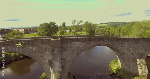 4k aerial footage of the Old Stirling Bridge on a bright sunny day.
