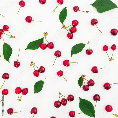 Tasty cherry and leaves on white background. Flat lay. Top view. Summer berries