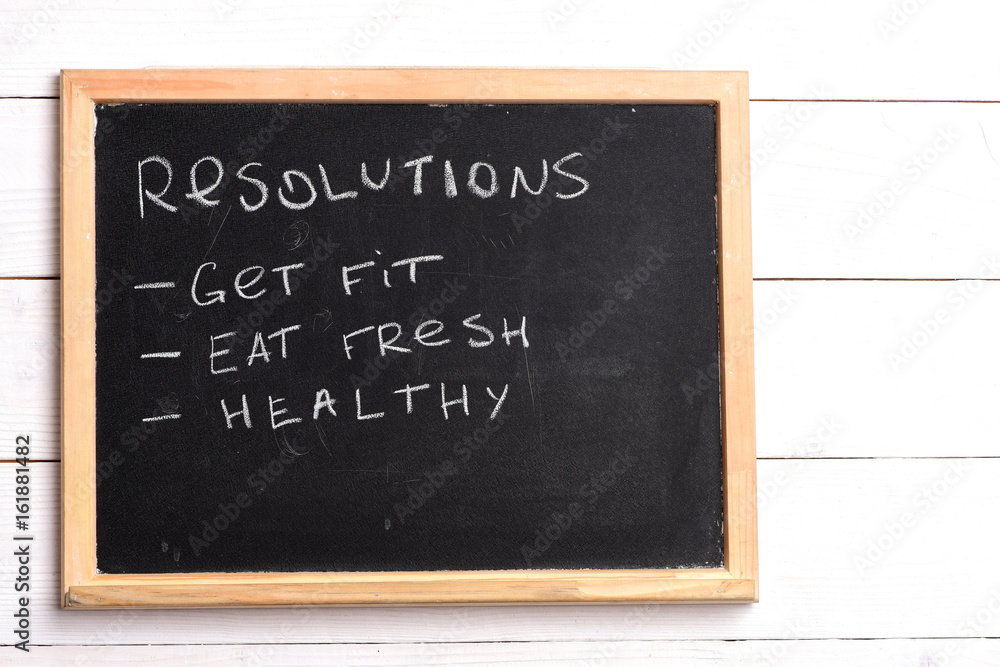 Fototapeta premium Blackboard with written checklist of resolutions