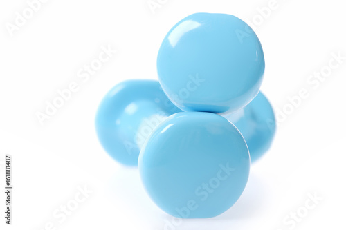 Two round edges of cyan blue dumbbells making minimalistic composition